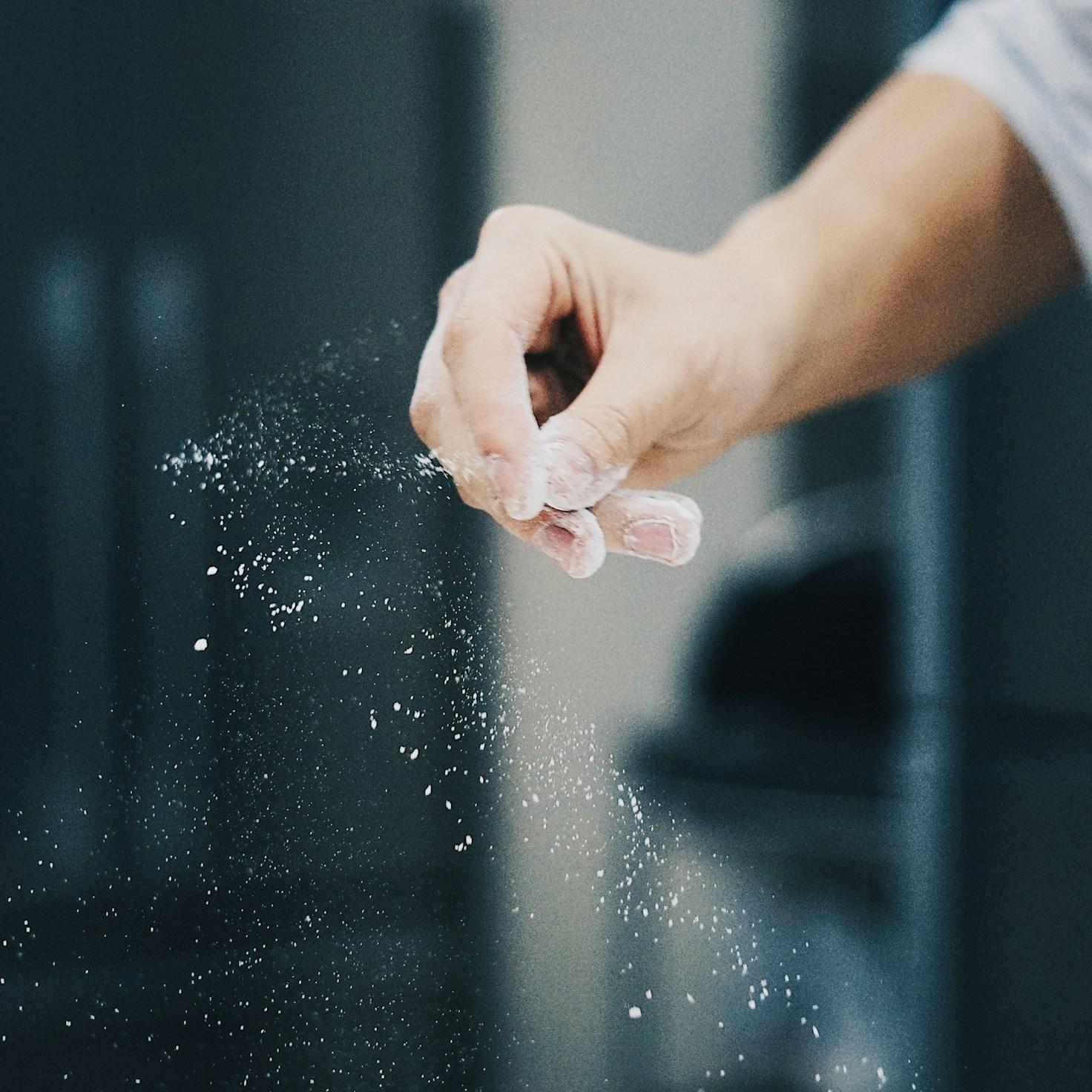 Diverse group of community members sharing a meal together, showcasing the social bonds formed through collaborative cooking